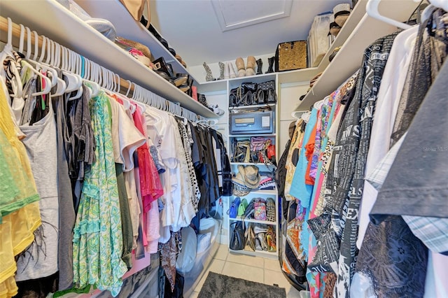 walk in closet with tile patterned flooring