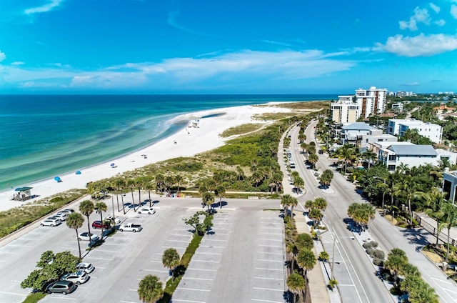 birds eye view of property with a view of the beach and a water view