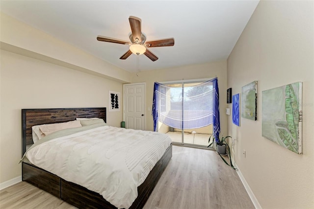 bedroom with ceiling fan and light hardwood / wood-style flooring