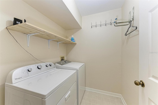 laundry area with independent washer and dryer