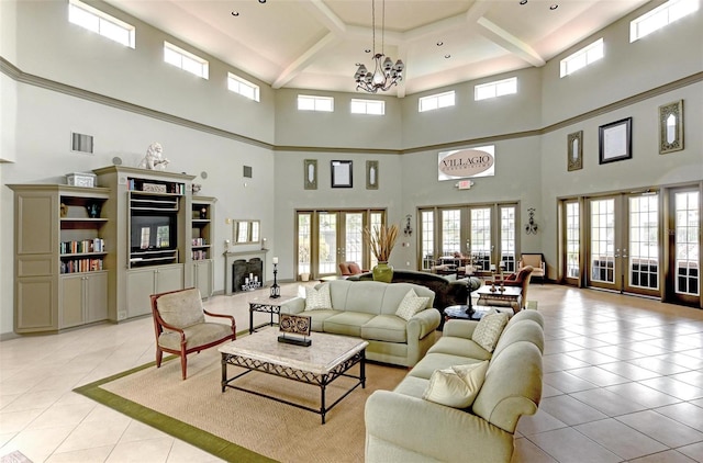 tiled living room with french doors, coffered ceiling, beamed ceiling, a notable chandelier, and a towering ceiling