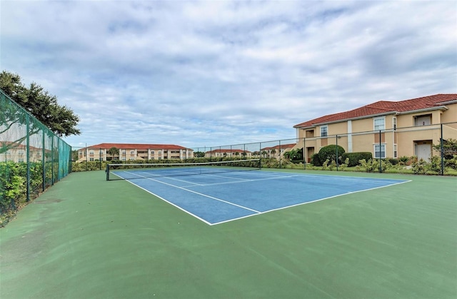 view of sport court featuring basketball hoop