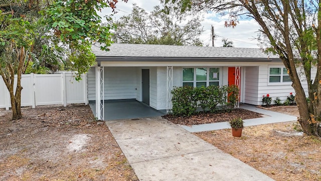 view of front of property featuring a carport