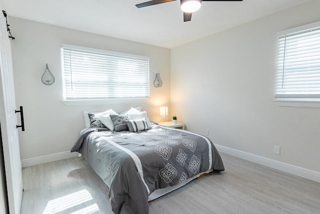 bedroom featuring light hardwood / wood-style floors and ceiling fan