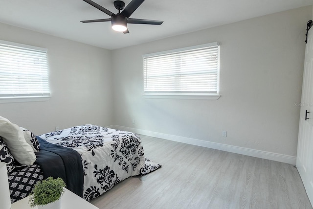 bedroom featuring light wood-type flooring and ceiling fan