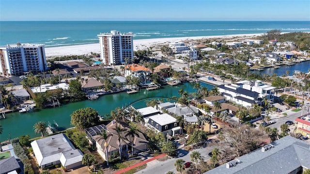 bird's eye view featuring a view of the beach and a water view