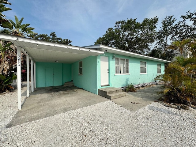 view of front facade featuring a carport