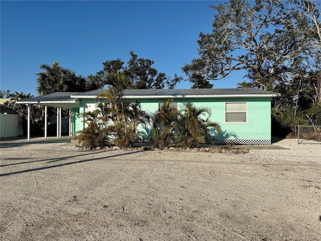 view of front of home featuring a carport