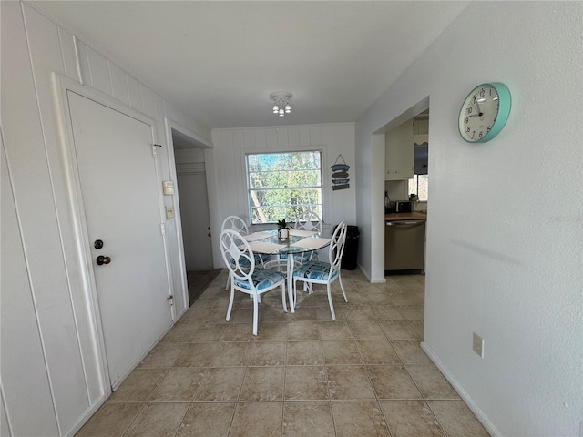 dining area featuring light tile patterned flooring