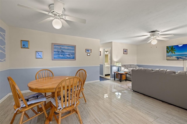 dining space featuring ceiling fan