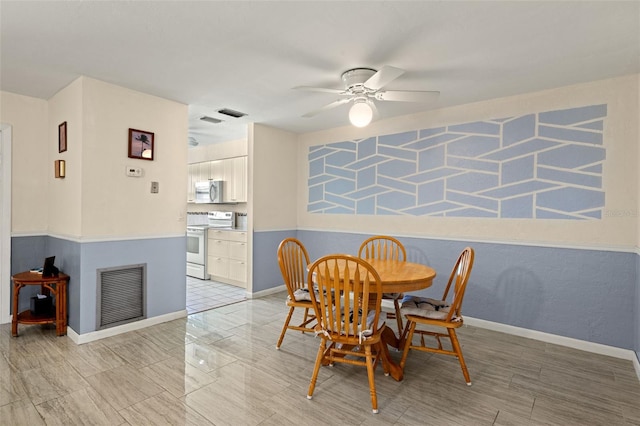 dining room featuring ceiling fan