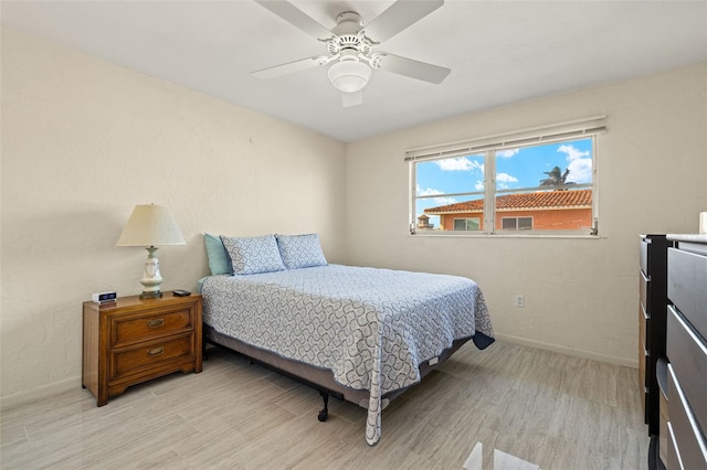 bedroom featuring ceiling fan and light wood-type flooring