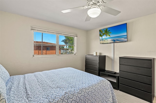 bedroom with light wood-type flooring and ceiling fan