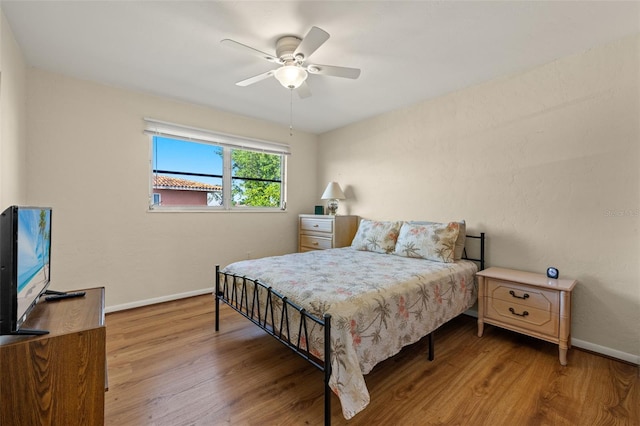 bedroom featuring hardwood / wood-style flooring and ceiling fan