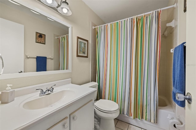 full bathroom featuring tile patterned floors, vanity, toilet, and shower / bath combo with shower curtain