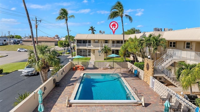 view of swimming pool featuring a patio