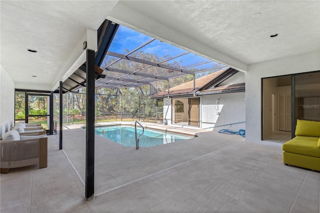 view of swimming pool featuring a patio and a lanai