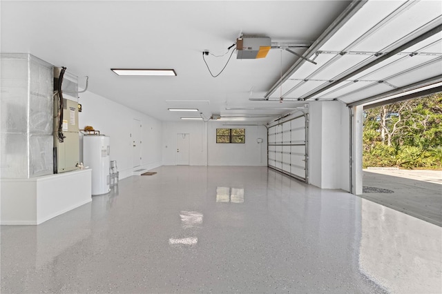 garage featuring water heater and a garage door opener