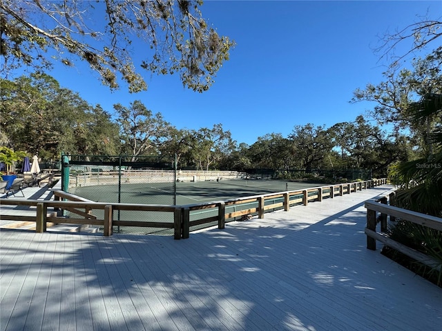 view of community with tennis court