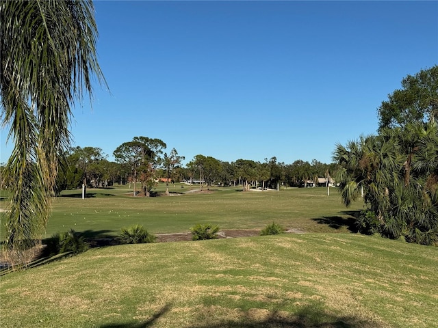 surrounding community featuring a lawn