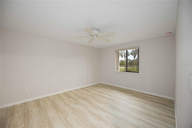 unfurnished room with light wood-type flooring and ceiling fan