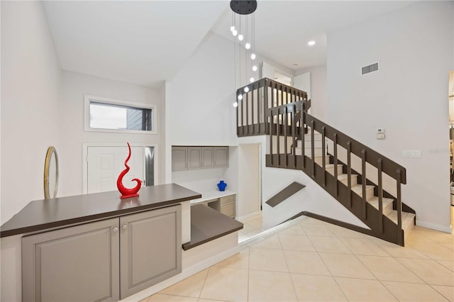 stairs featuring tile patterned flooring