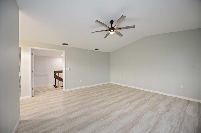 spare room with light wood-type flooring, ceiling fan, and lofted ceiling