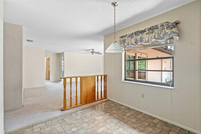 2807 Country River Dr, Parrish, FL 34219 - spare room with healthy amount of natural light, a ceiling fan, a textured ceiling, and baseboards