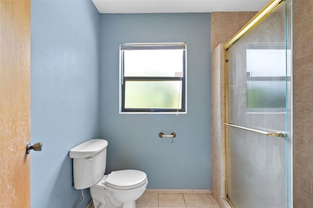 2807 Country River Dr, Parrish, FL 34219 - full bath with toilet, an enclosed shower, and tile patterned floors