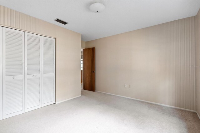 2807 Country River Dr, Parrish, FL 34219 - unfurnished bedroom with carpet floors, a closet, and baseboards