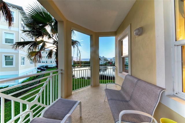 balcony featuring a water view