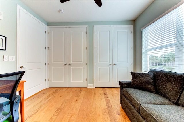 interior space with ceiling fan and light hardwood / wood-style floors