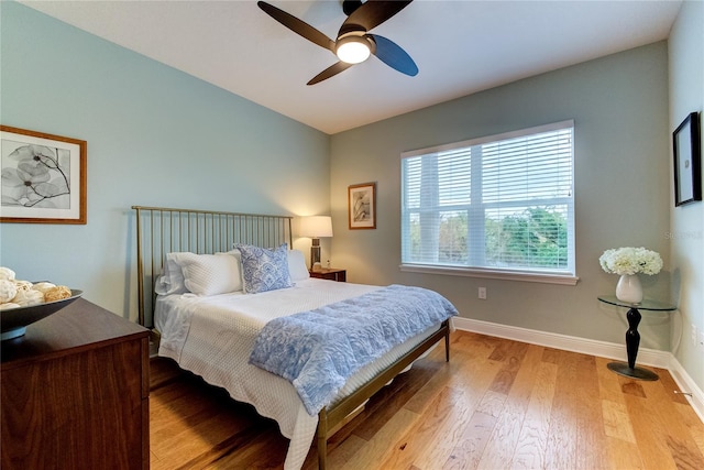 bedroom featuring ceiling fan and light hardwood / wood-style floors