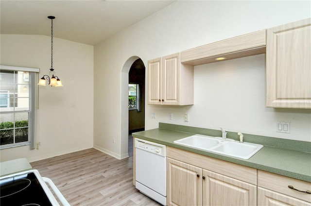 kitchen featuring dishwasher, hanging light fixtures, plenty of natural light, and sink