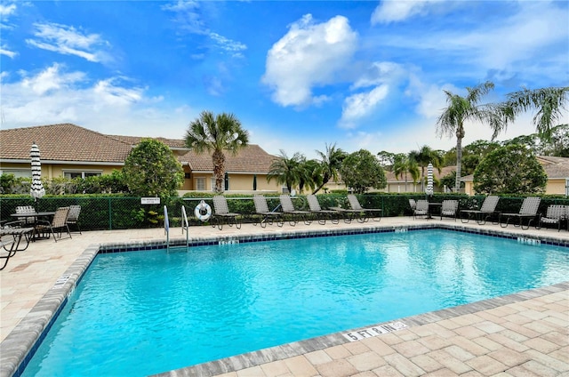 view of swimming pool featuring a patio