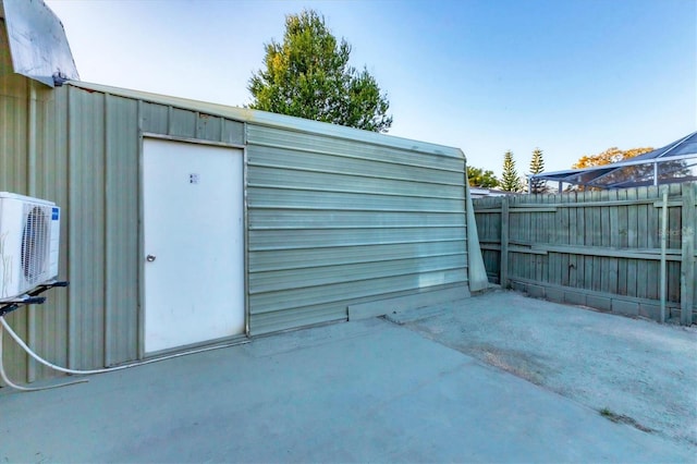 view of outbuilding featuring ac unit