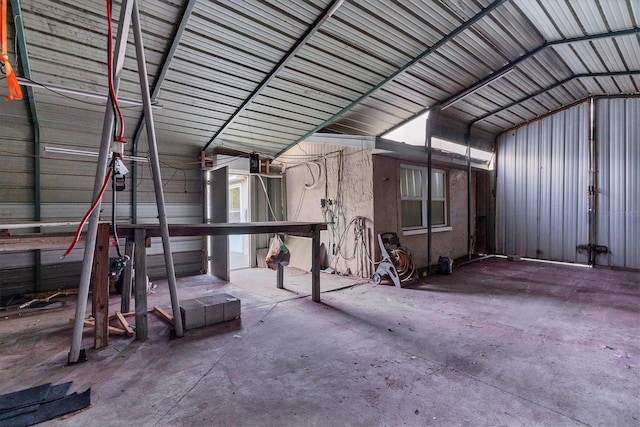 misc room featuring concrete floors and lofted ceiling