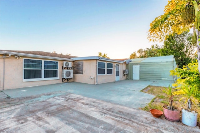 back of house with a patio area