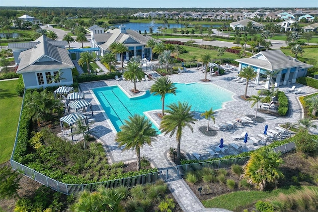 birds eye view of property with a water view