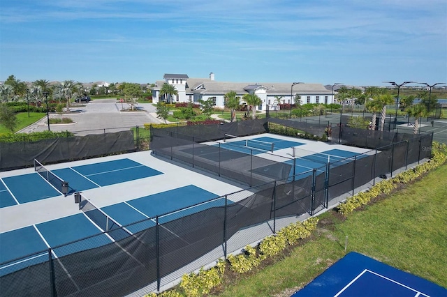 view of tennis court featuring basketball court