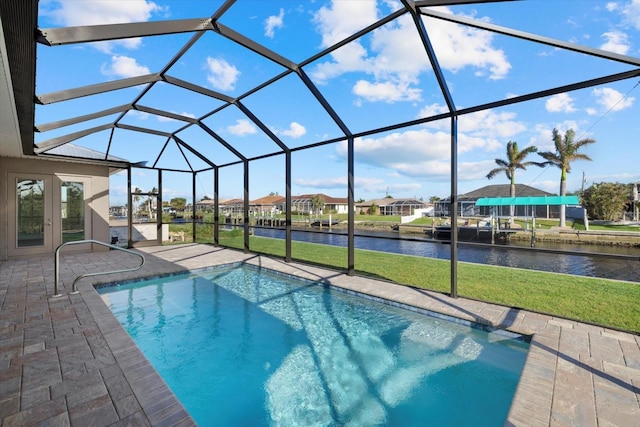 view of swimming pool with french doors, a water view, glass enclosure, and a patio area