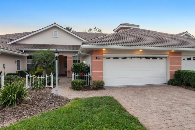 ranch-style home with a garage