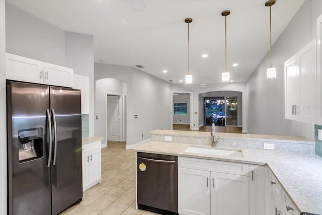 kitchen featuring sink, hanging light fixtures, light stone countertops, white cabinetry, and stainless steel appliances