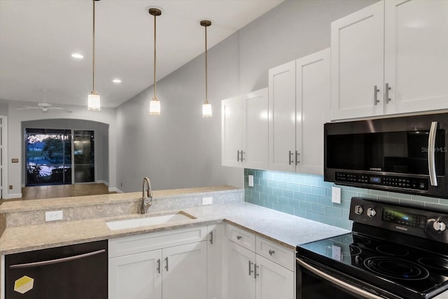 kitchen featuring white cabinetry, sink, ceiling fan, and stainless steel appliances