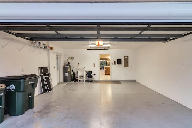 garage featuring electric panel and water heater