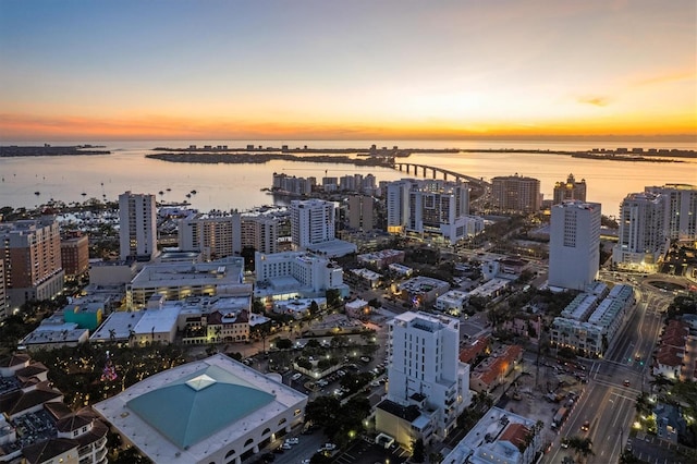 aerial view at dusk with a water view