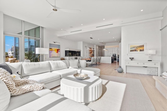 1335 2nd St Unit 301, Sarasota, FL 34236 - living room with light wood finished floors and recessed lighting