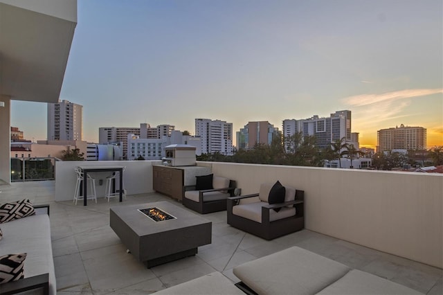 patio terrace at dusk with a fire pit