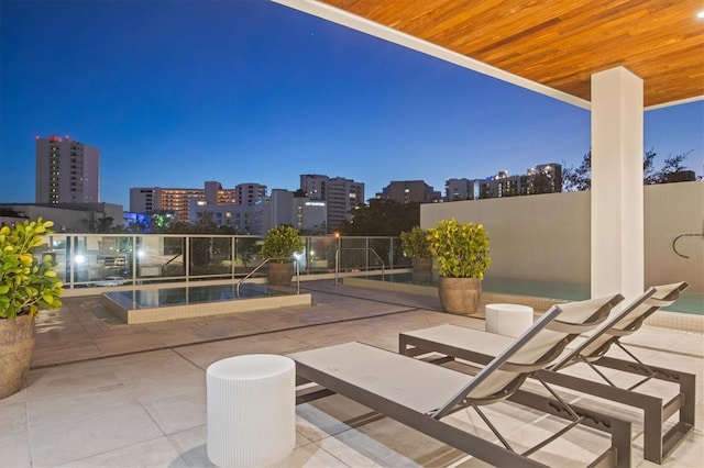 view of patio terrace at dusk