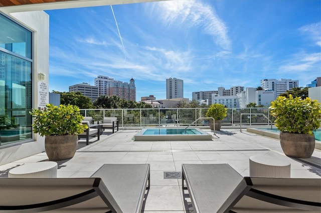 view of swimming pool featuring a patio area